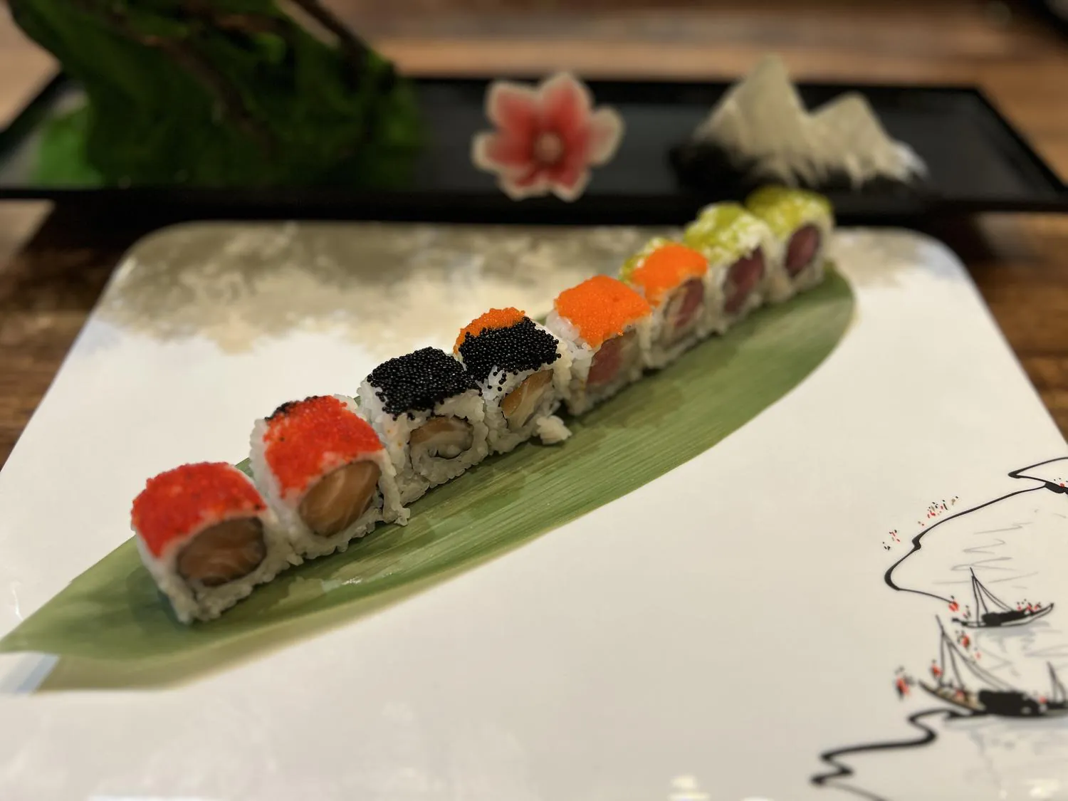 Colorful sushi roll with assorted fish and caviar at Sushi Kingdom Glen Allen, a Japanese Restaurant in Glen Allen